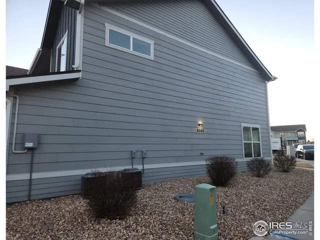a view of a backyard with sitting area