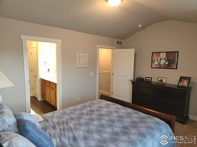 a bedroom with a bed and furniture