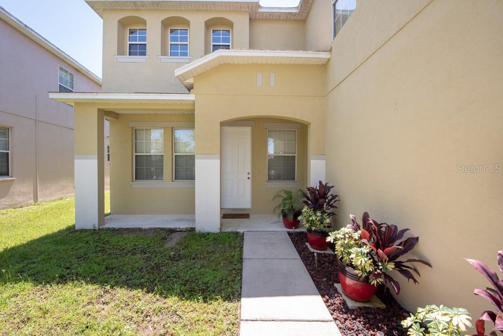 11130 Rising Mist Boulevard Riverview, FL 33578 - Photo 1 of 1 a front view of a house with a garden