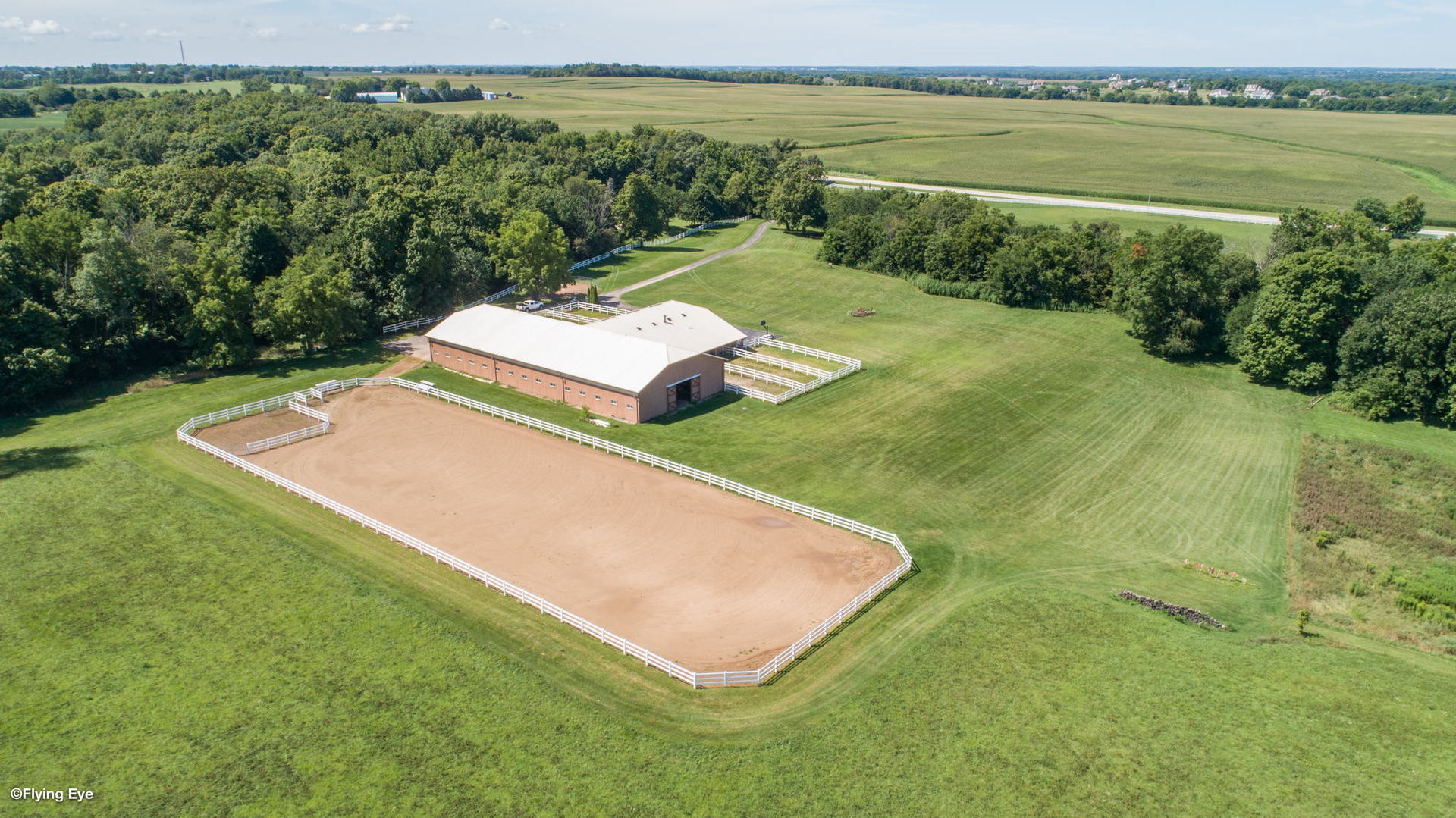 8970 Millbrook Road Millbrook, IL 60541 - Photo 2 of 30 a view of a swimming pool and lake from a balcony