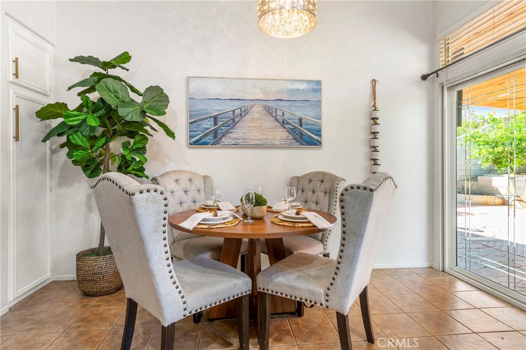 16366 West Sun Canyon Street Riverside, CA 92503 - Photo 6 of 21 a dining room with furniture and a potted plant
