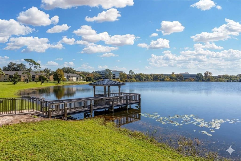 912 Lake Destiny Road, Unit F Altamonte Springs, FL 32714 - Photo 11 of 12 a view of a lake with houses in the back