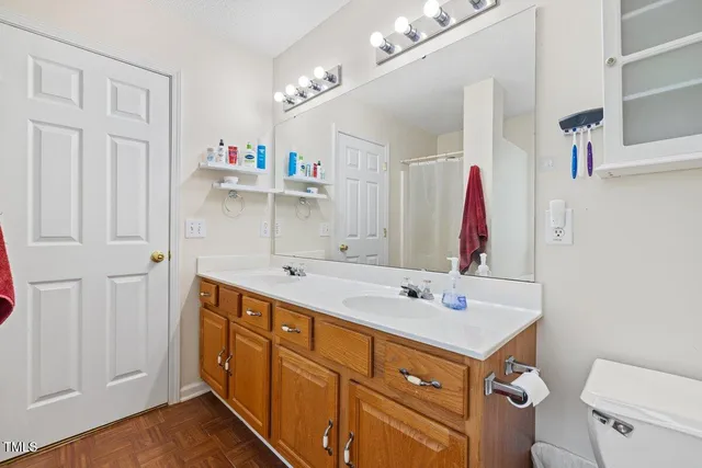 a bathroom with a sink vanity and mirror