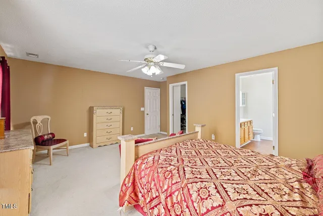 a bedroom with a bed dresser and a window