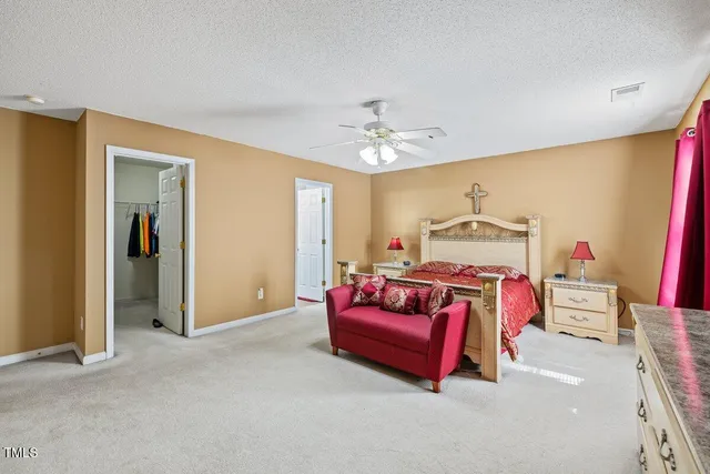 a bed room with a bed and a chandelier