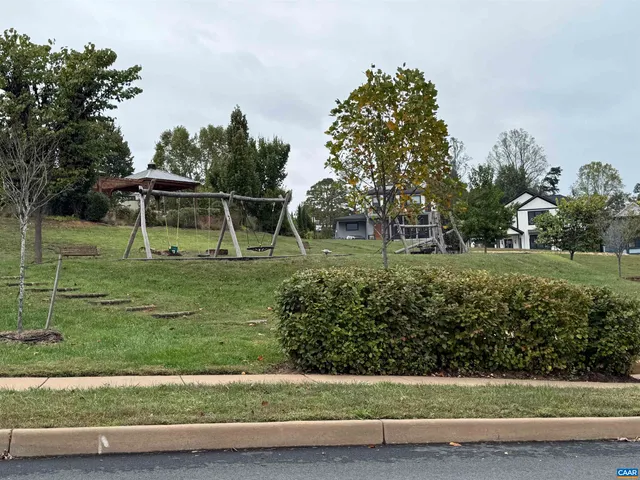 a view of a park with a house