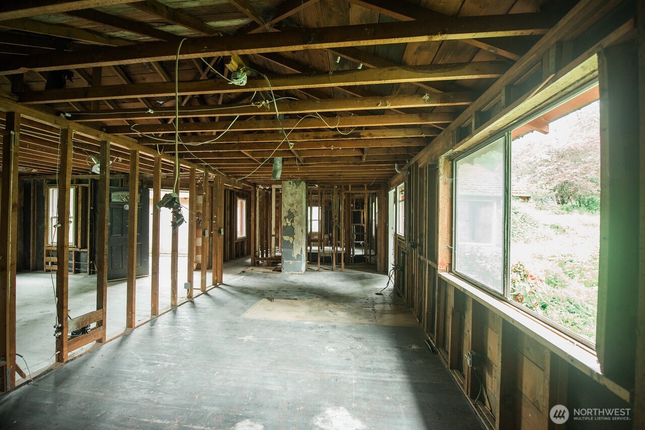 10379 Bethel Burley Road Southeast Port Orchard, WA 98367 - Photo 13 of 40 a view of a room with large windows