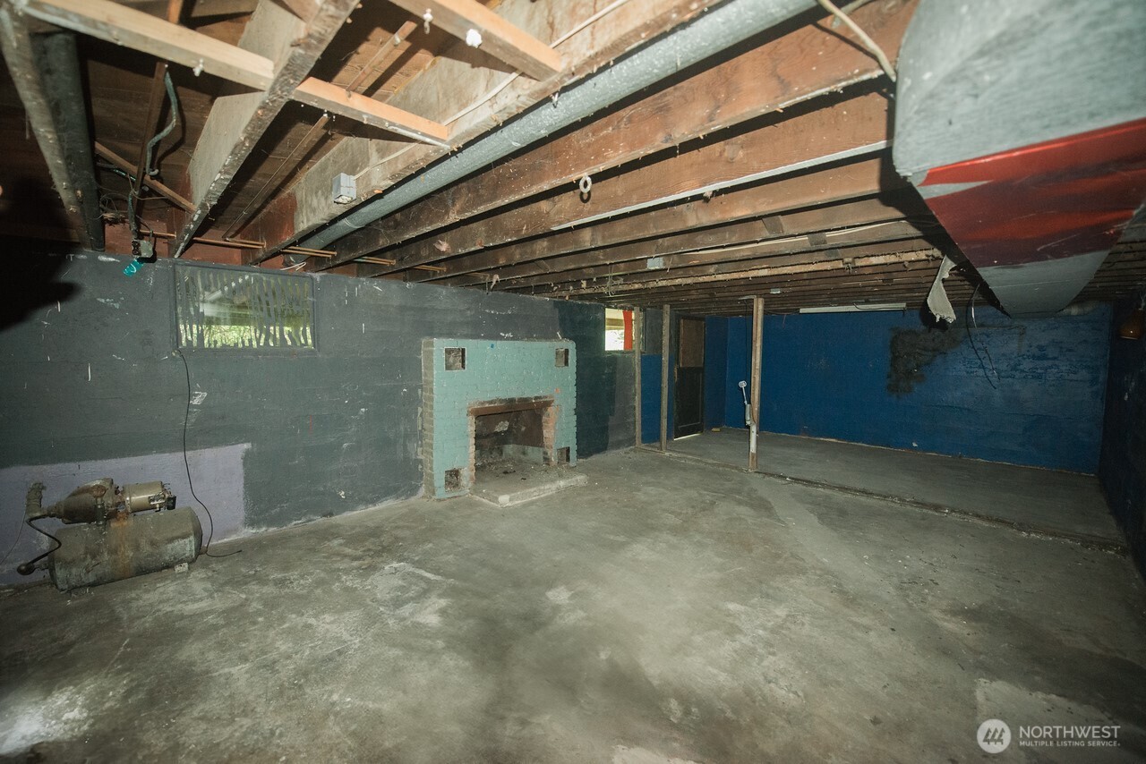 10379 Bethel Burley Road Southeast Port Orchard, WA 98367 - Photo 20 of 40 a view of empty room with wooden walls