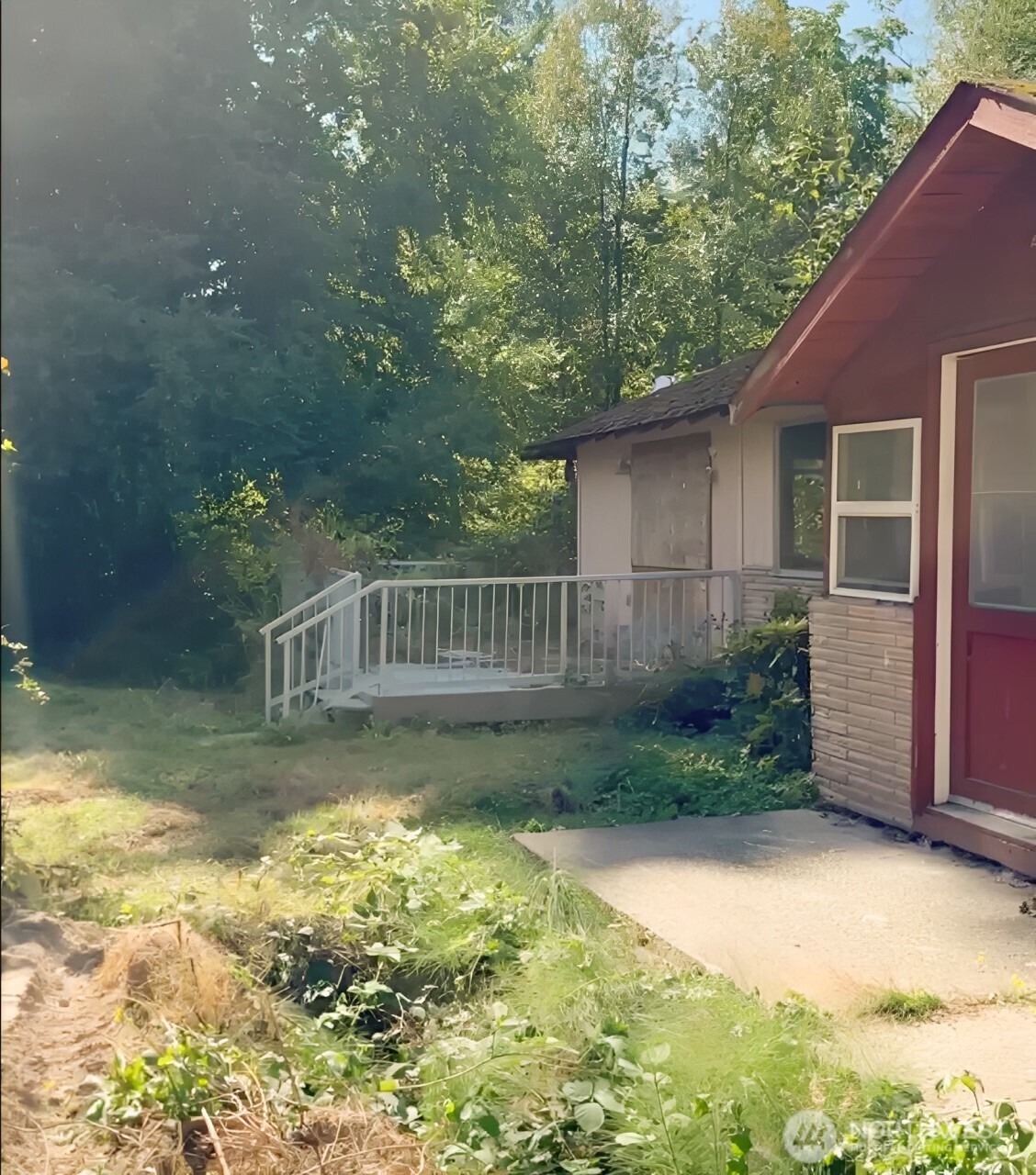 10379 Bethel Burley Road Southeast Port Orchard, WA 98367 - Photo 36 of 40 a view of a house with backyard and garden