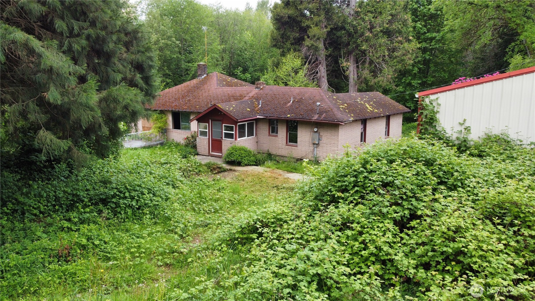 10379 Bethel Burley Road Southeast Port Orchard, WA 98367 - Photo 37 of 40 a house view with a garden space