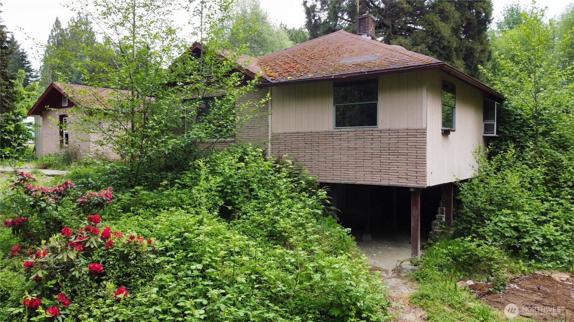 10379 Bethel Burley Road Southeast Port Orchard, WA 98367 - Photo 40 of 40 a aerial view of a house with a yard and potted plants