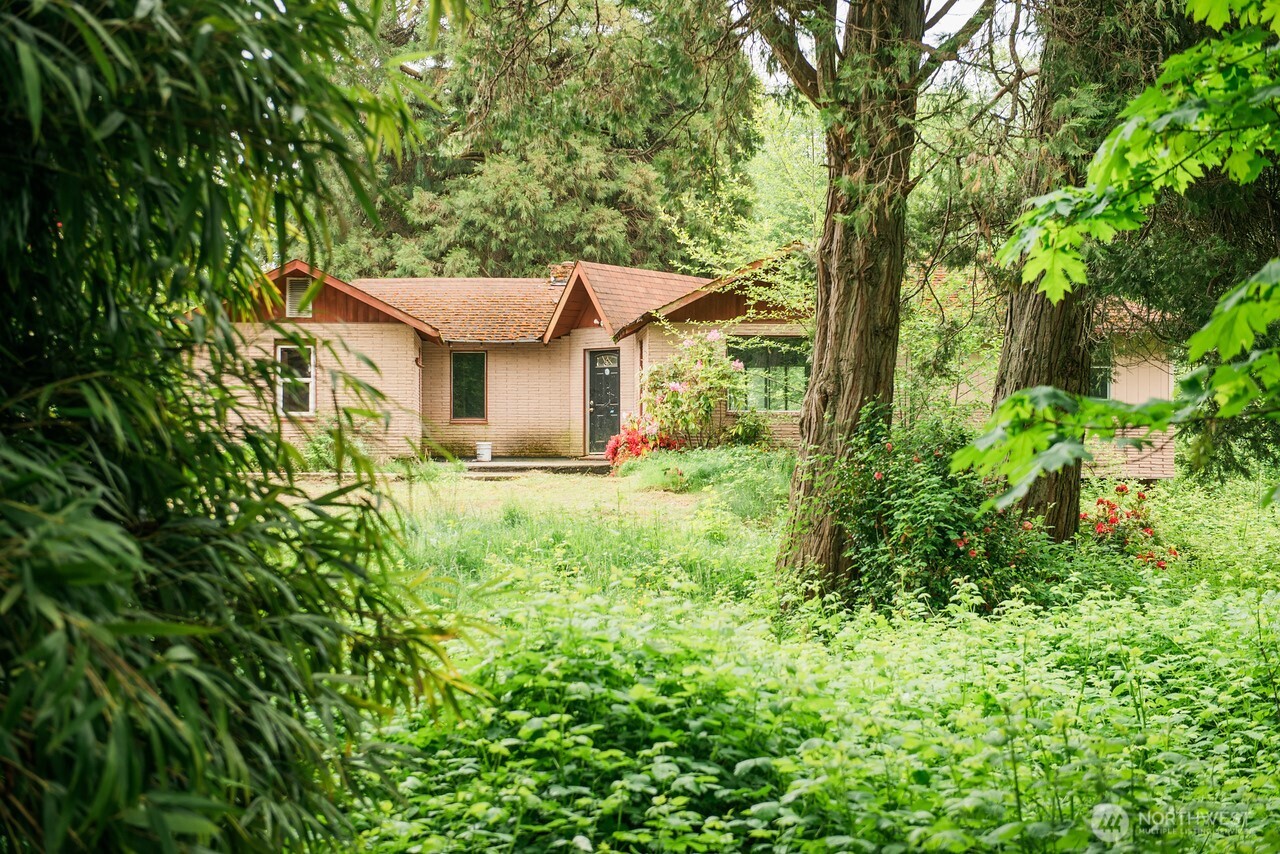 10379 Bethel Burley Road Southeast Port Orchard, WA 98367 - Photo 5 of 40 front view of a house with a tree