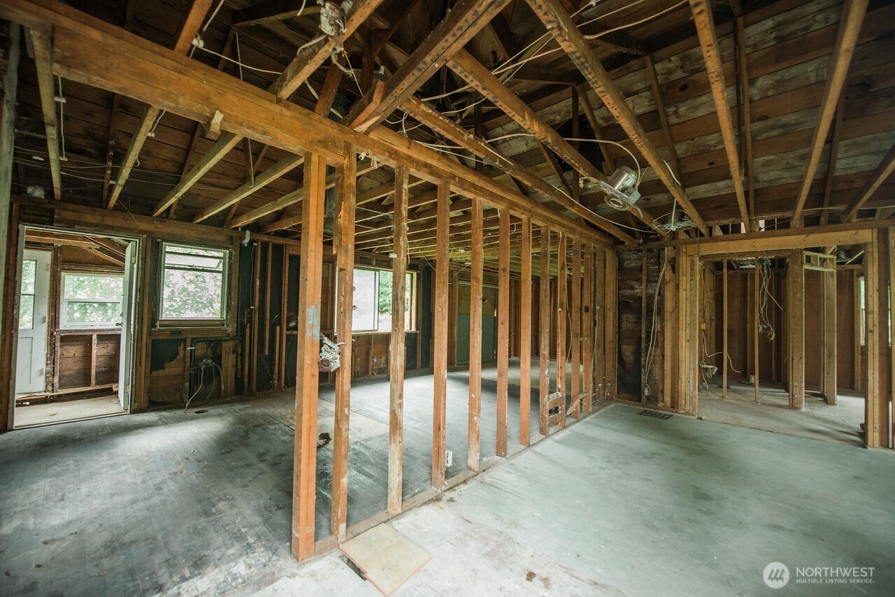 10379 Bethel Burley Road Southeast Port Orchard, WA 98367 - Photo 8 of 40 a view of a room with wooden walls