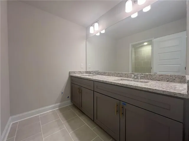a bathroom with a sink a vanity and a mirror