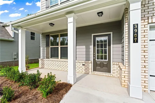 a front view of a house with a large window