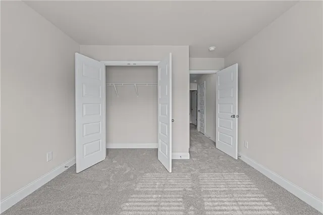 a view of a park with a trees in the background