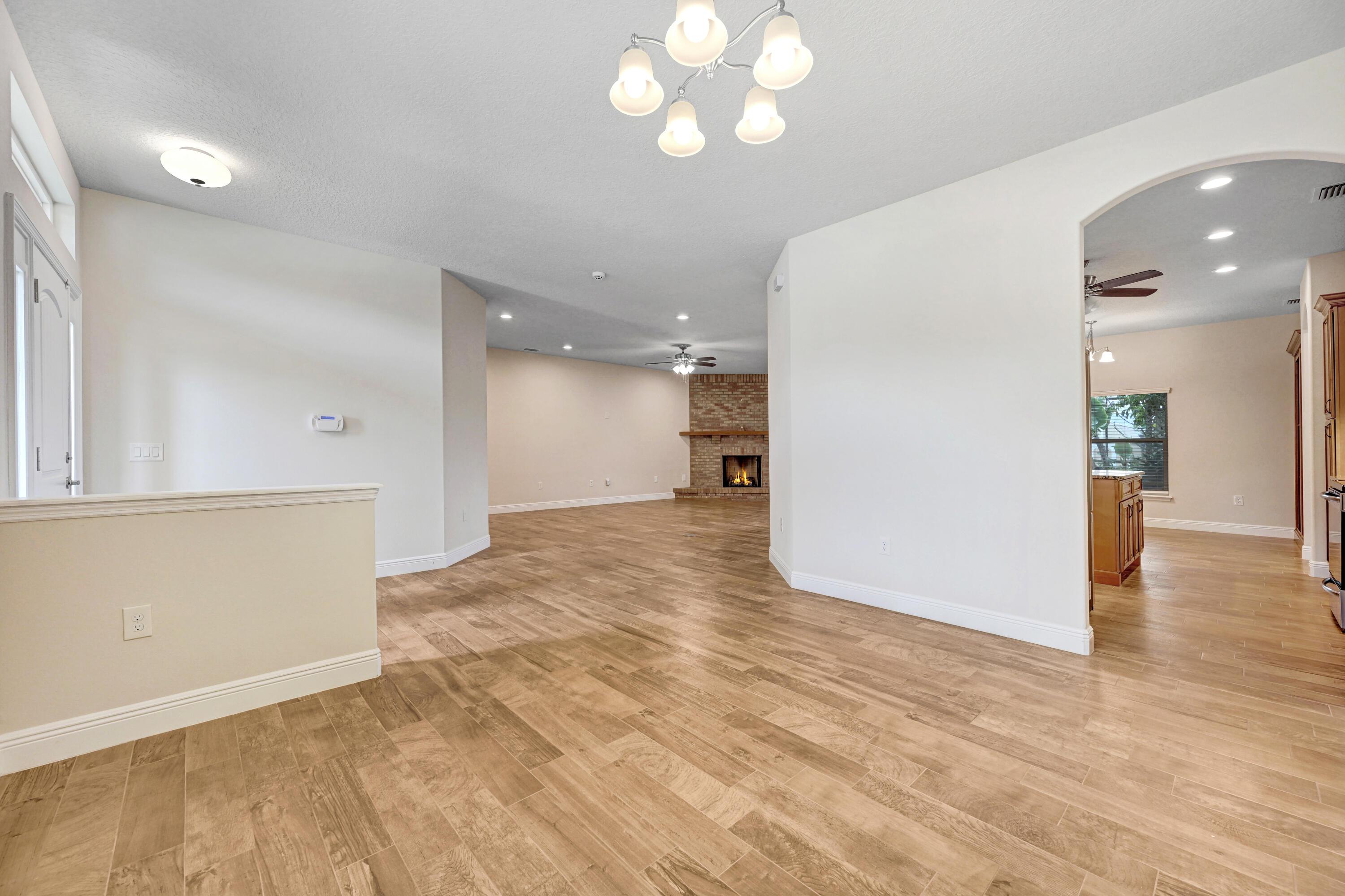 2690 Weber Road Malabar, FL 32950 - Photo 60 of 60 a view of a hallway with wooden floor and a kitchen