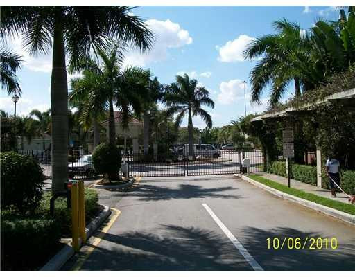 3345 Merrick Lane, Unit 1101 Margate, FL 33063 - Photo 3 of 9 a view of swimming pool with palm trees