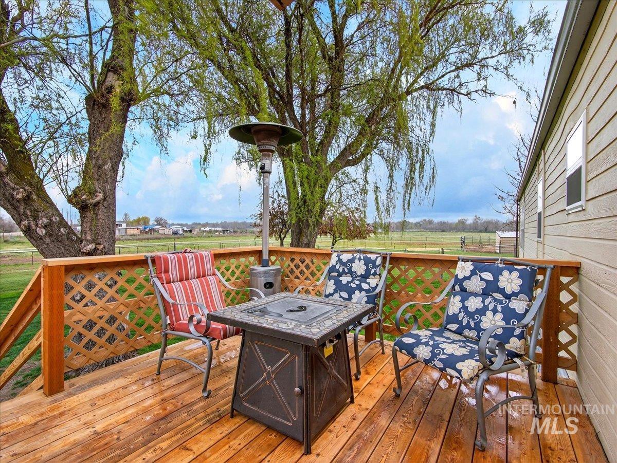 9228 Washoe Road Payette, ID 83661 - Photo 33 of 49 Wooden deck featuring an outdoor fire pit
