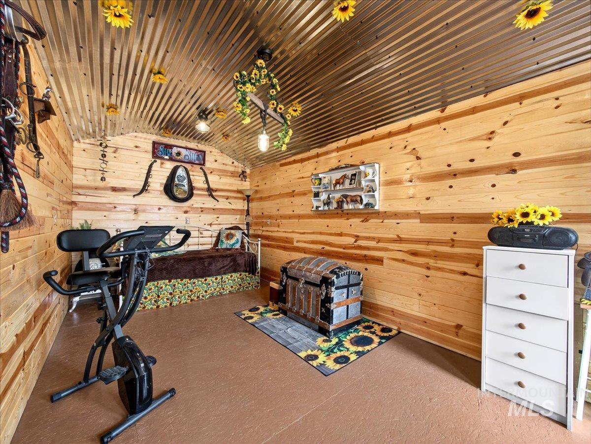 9228 Washoe Road Payette, ID 83661 - Photo 37 of 49 Bedroom with wooden walls and vaulted ceiling