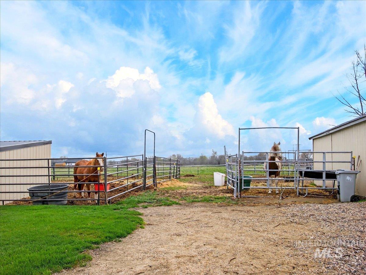 9228 Washoe Road Payette, ID 83661 - Photo 39 of 49 View of yard with an outbuilding, a rural view, and an exterior structure