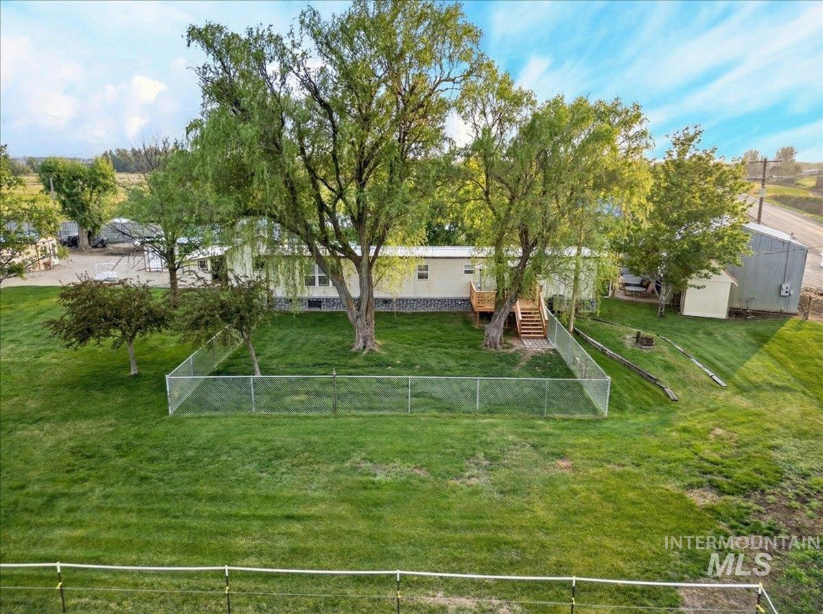 9228 Washoe Road Payette, ID 83661 - Photo 40 of 49 Fenced backyard with stairs and a shed