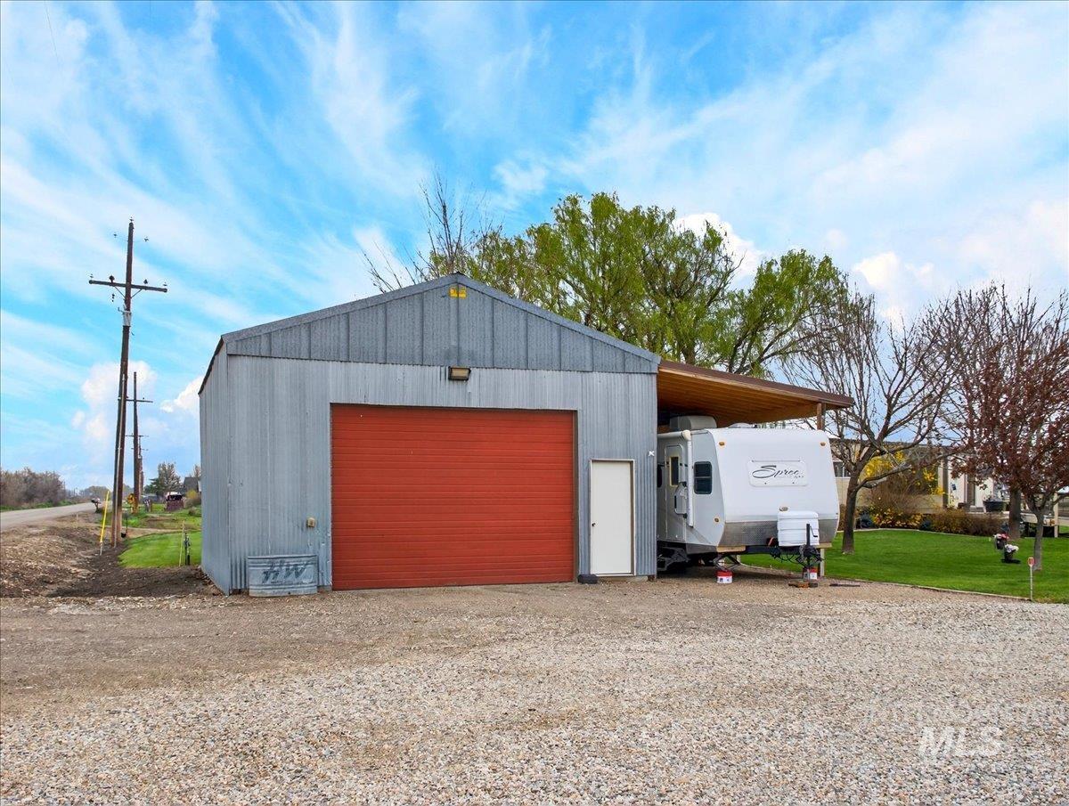 9228 Washoe Road Payette, ID 83661 - Photo 6 of 49 Garage featuring a garage and driveway