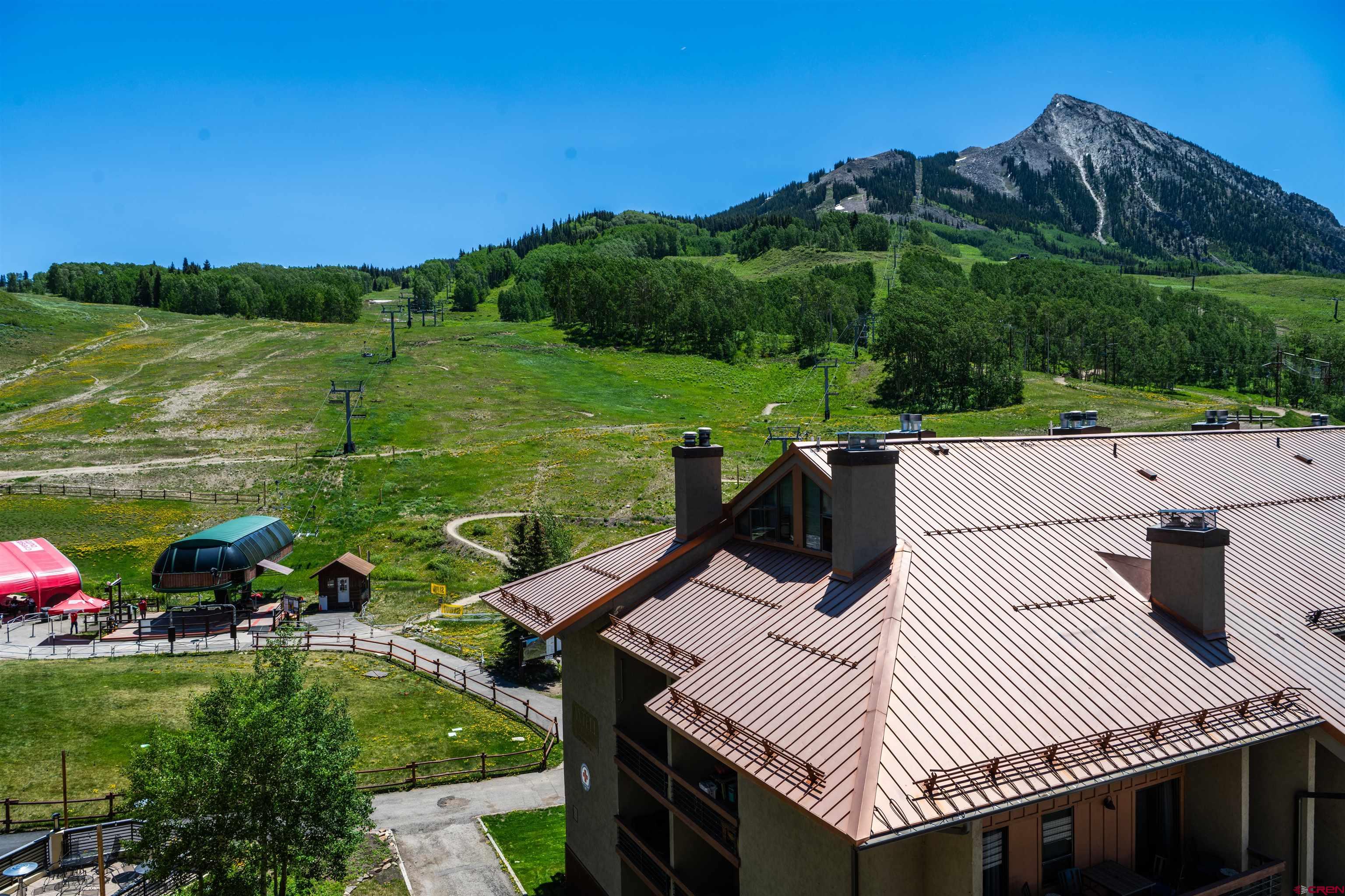 500 Gothic Road, Unit 620 Crested Butte, CO 81225 - Photo 21 of 23 a view of a chairs and table on the terrace