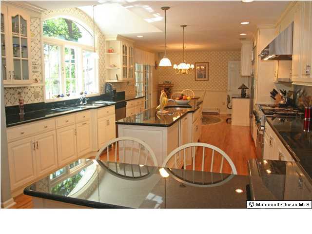 268 Pelican Road Middletown, NJ 07748 - Photo 2 of 21 a kitchen with sink and view of living room