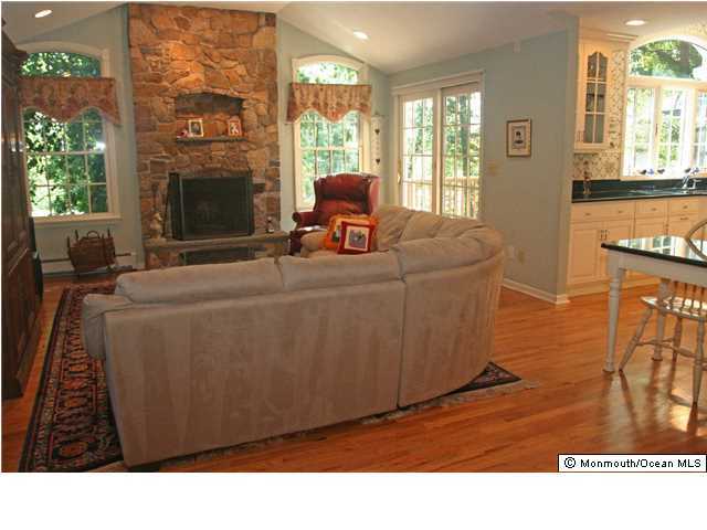 268 Pelican Road Middletown, NJ 07748 - Photo 3 of 21 a living room with furniture and a fireplace