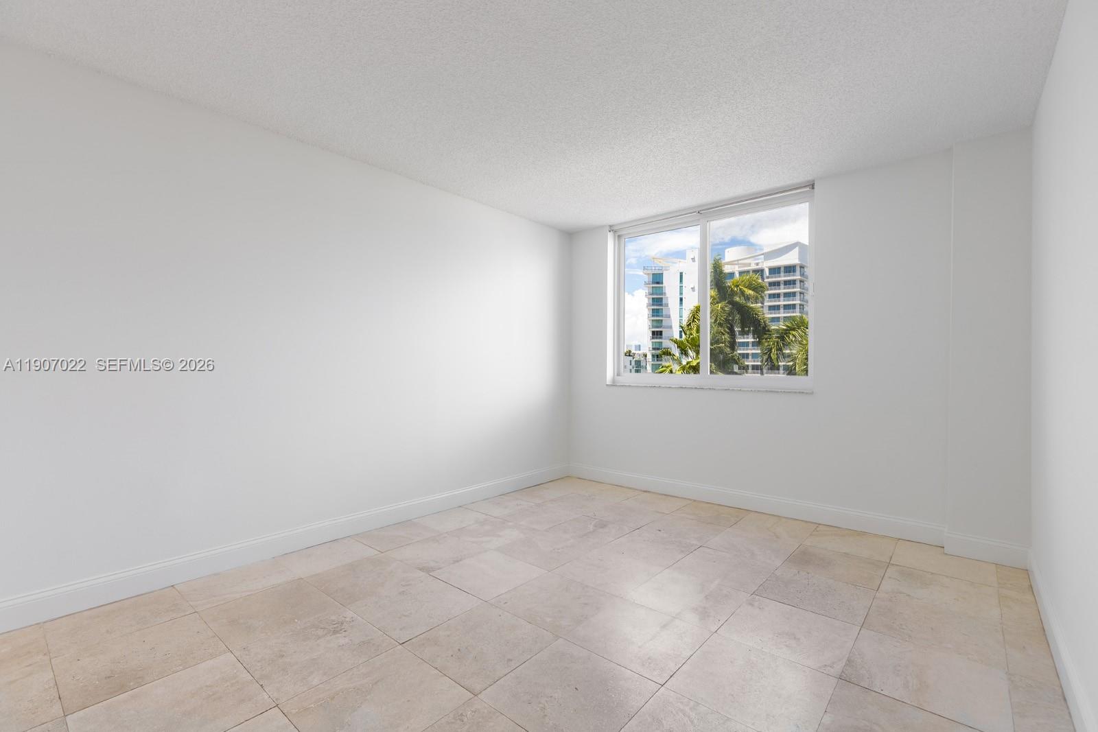 1621 Bay Road, Unit 604 Miami Beach, FL 33139 - Photo 13 of 30 an empty room with windows