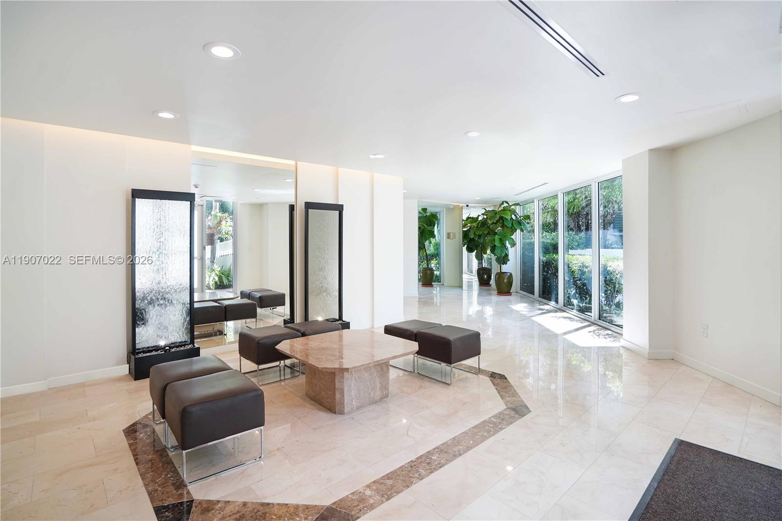 1621 Bay Road, Unit 604 Miami Beach, FL 33139 - Photo 25 of 30 a living room with furniture and a large window