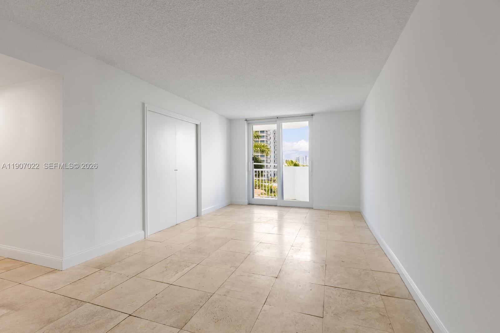1621 Bay Road, Unit 604 Miami Beach, FL 33139 - Photo 8 of 30 a view of an empty room with a window