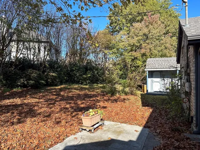 a backyard of a house with lots of green space