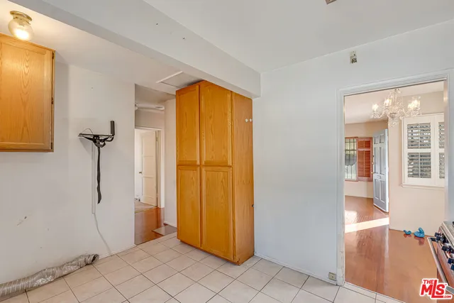a view of a livingroom with a ceiling fan and window