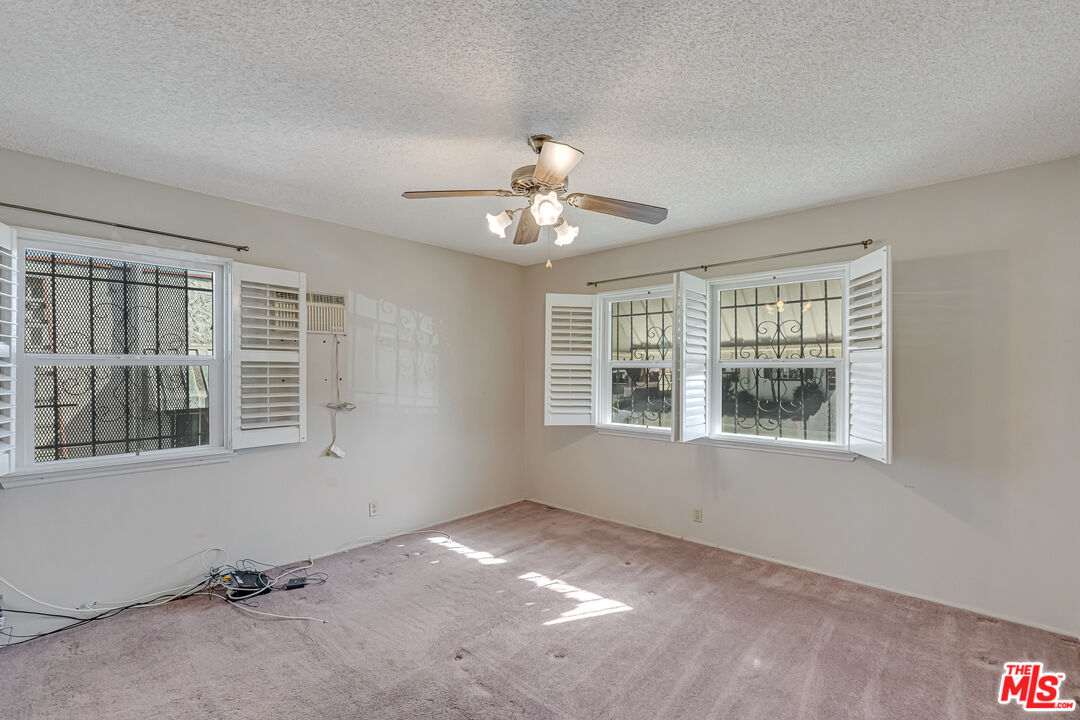 331 East 119th Street Los Angeles, CA 90061 - Photo 14 of 40 a view of a livingroom with a ceiling fan and window