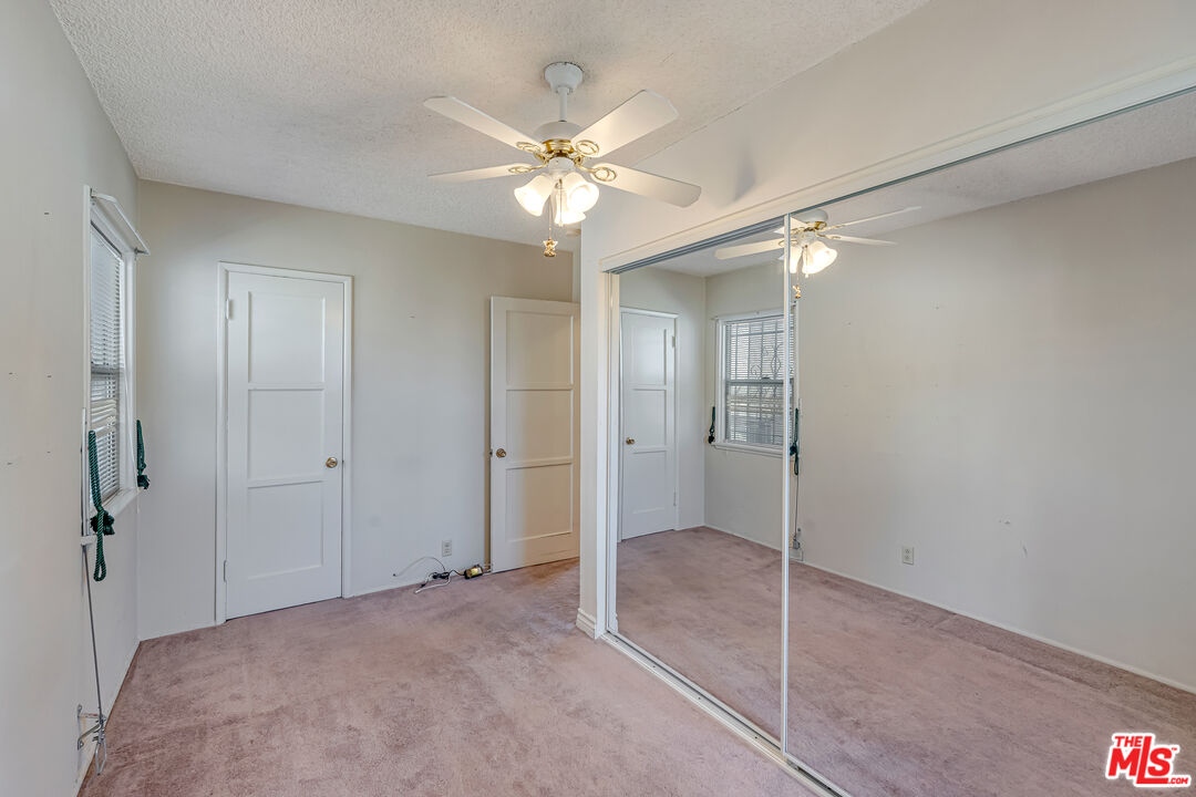 331 East 119th Street Los Angeles, CA 90061 - Photo 17 of 40 a view of a room with a ceiling fan