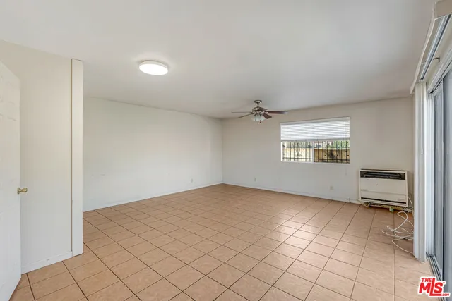 a bathroom with a shower a toilet and a sink