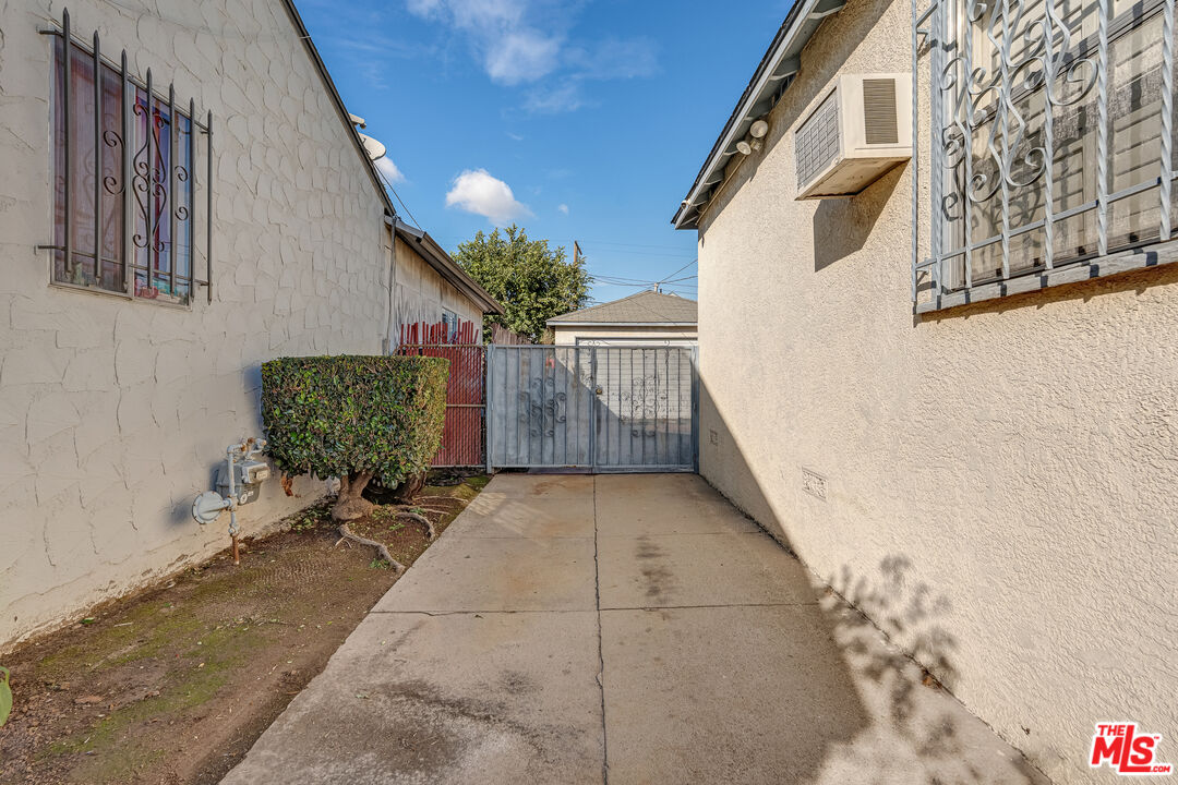 331 East 119th Street Los Angeles, CA 90061 - Photo 38 of 40 a backyard of a house with outdoor seating