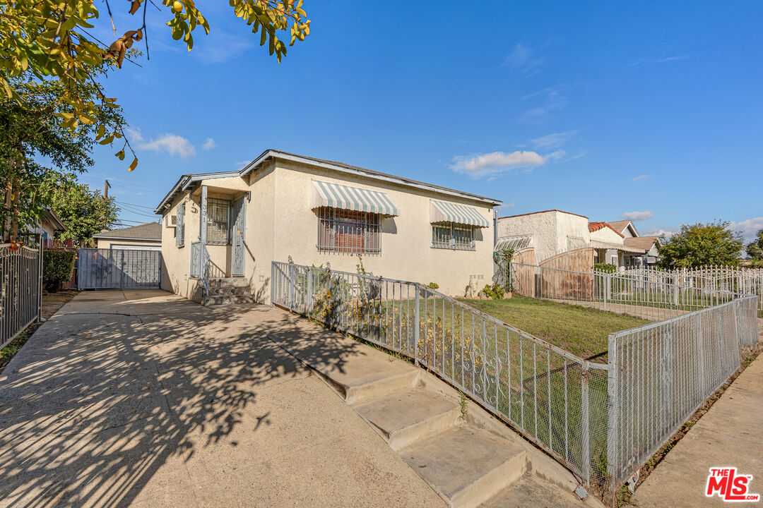 331 East 119th Street Los Angeles, CA 90061 - Photo 39 of 40 a view of a house with a yard