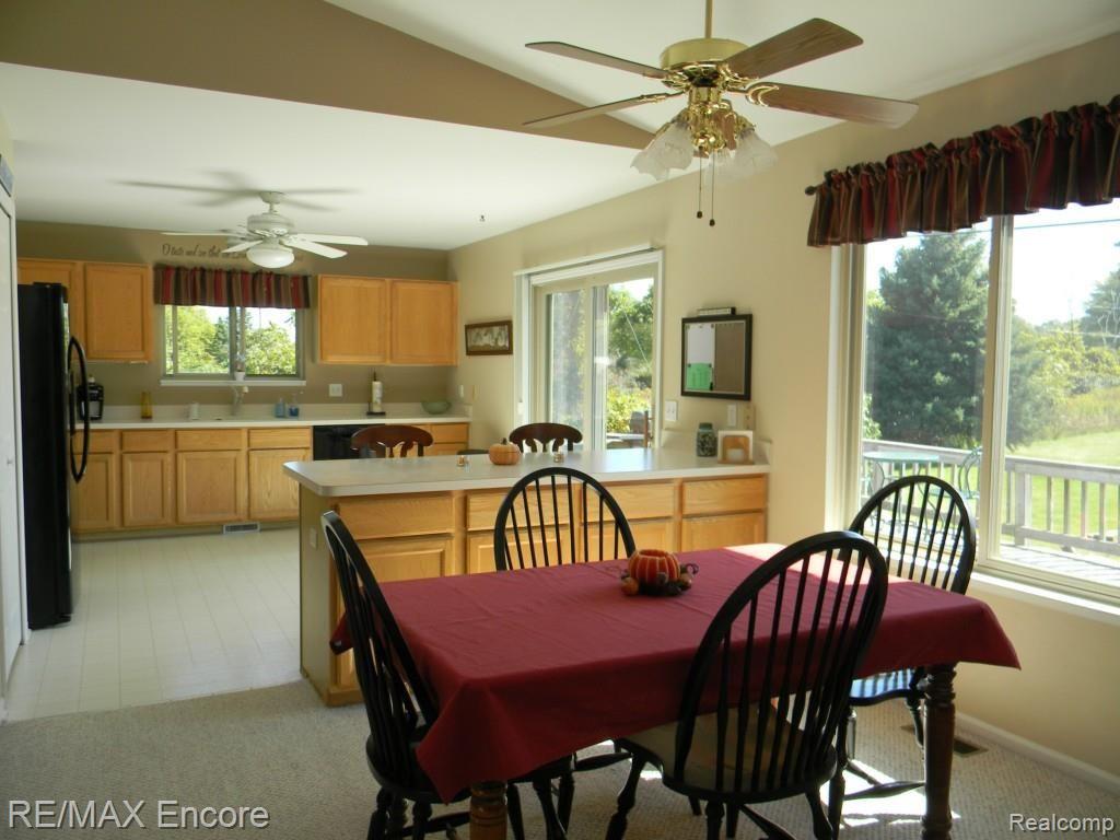 124 East Rattalee Lake Road Holly, MI 48442 - Photo 9 of 35 Dining are open to the kitchen and great room