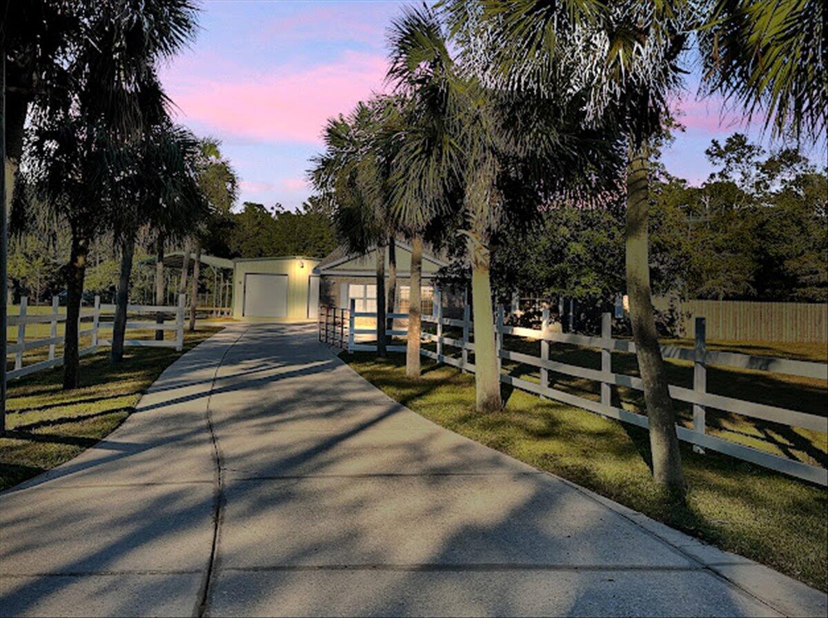 208 Hinote Road DeFuniak Springs, FL 32433 - Photo 1 of 49 a view of a park with swings and slides