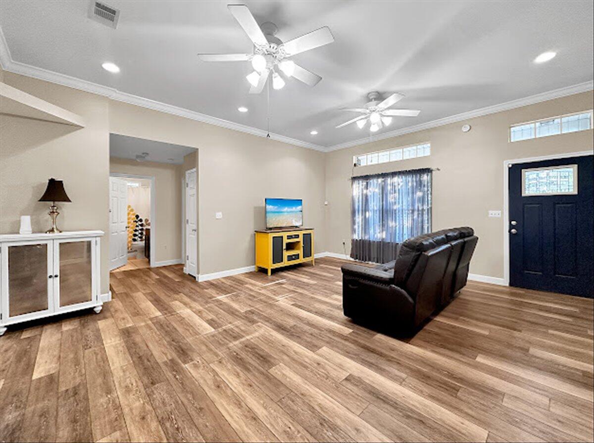 208 Hinote Road DeFuniak Springs, FL 32433 - Photo 12 of 49 a living room with furniture and a flat screen tv
