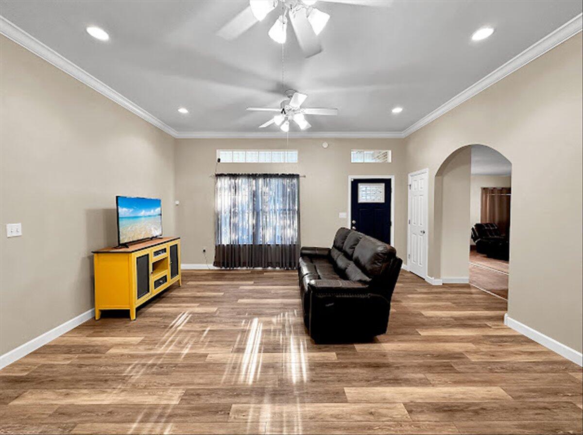 208 Hinote Road DeFuniak Springs, FL 32433 - Photo 13 of 49 a living room with furniture and a flat screen tv
