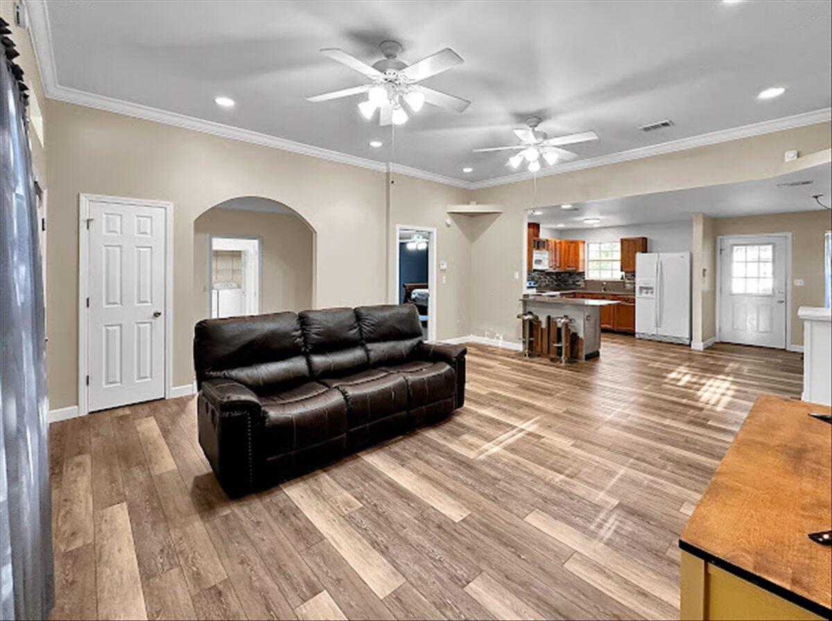 208 Hinote Road DeFuniak Springs, FL 32433 - Photo 14 of 49 a living room with furniture and a wooden floor