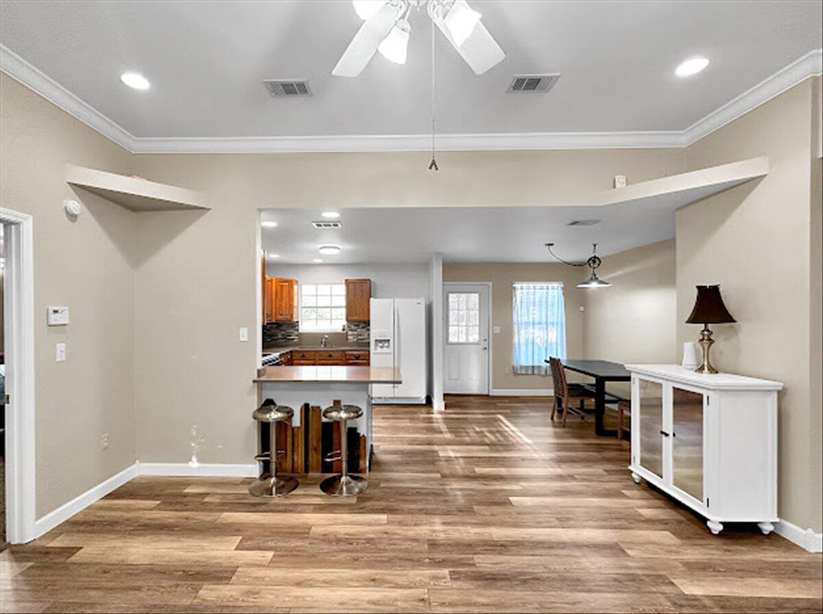 208 Hinote Road DeFuniak Springs, FL 32433 - Photo 15 of 49 a view of a room with wooden floor and staircase