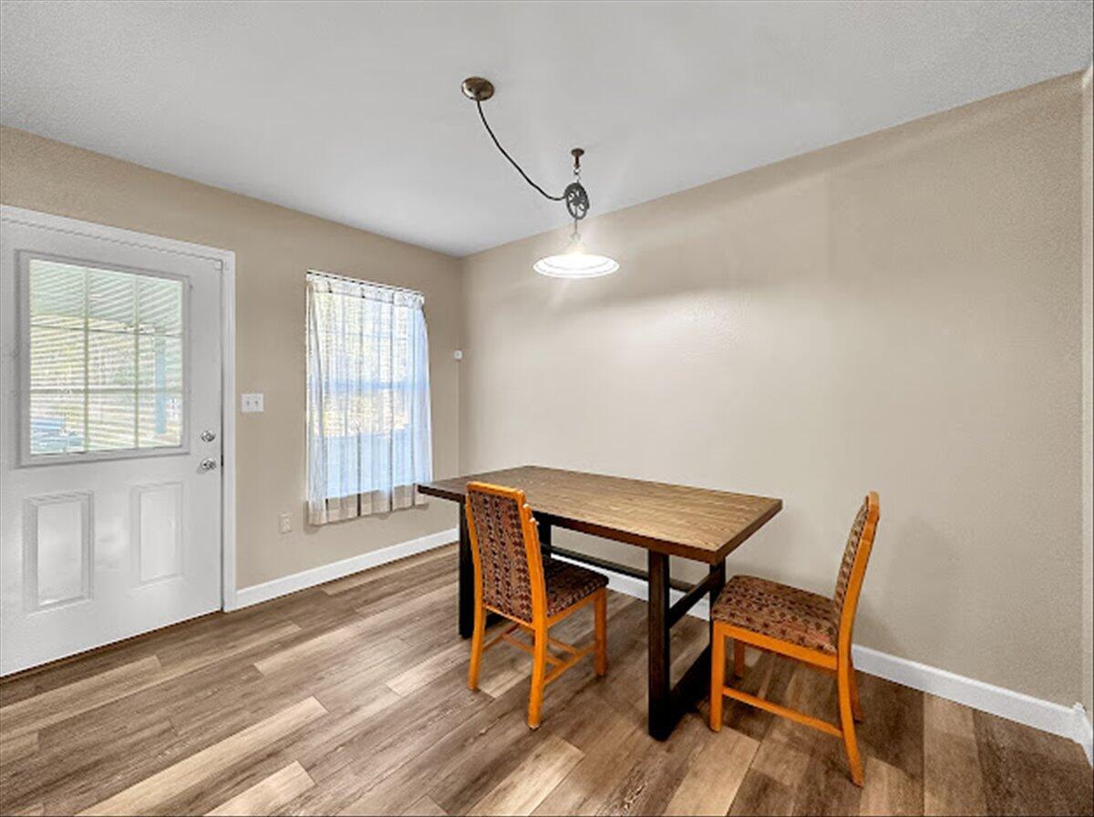208 Hinote Road DeFuniak Springs, FL 32433 - Photo 17 of 49 a view of a room with furniture wooden floor and staircase