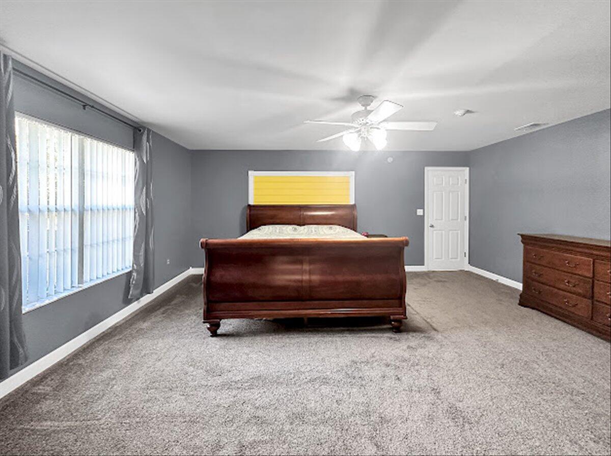 208 Hinote Road DeFuniak Springs, FL 32433 - Photo 22 of 49 a bedroom with bed and window