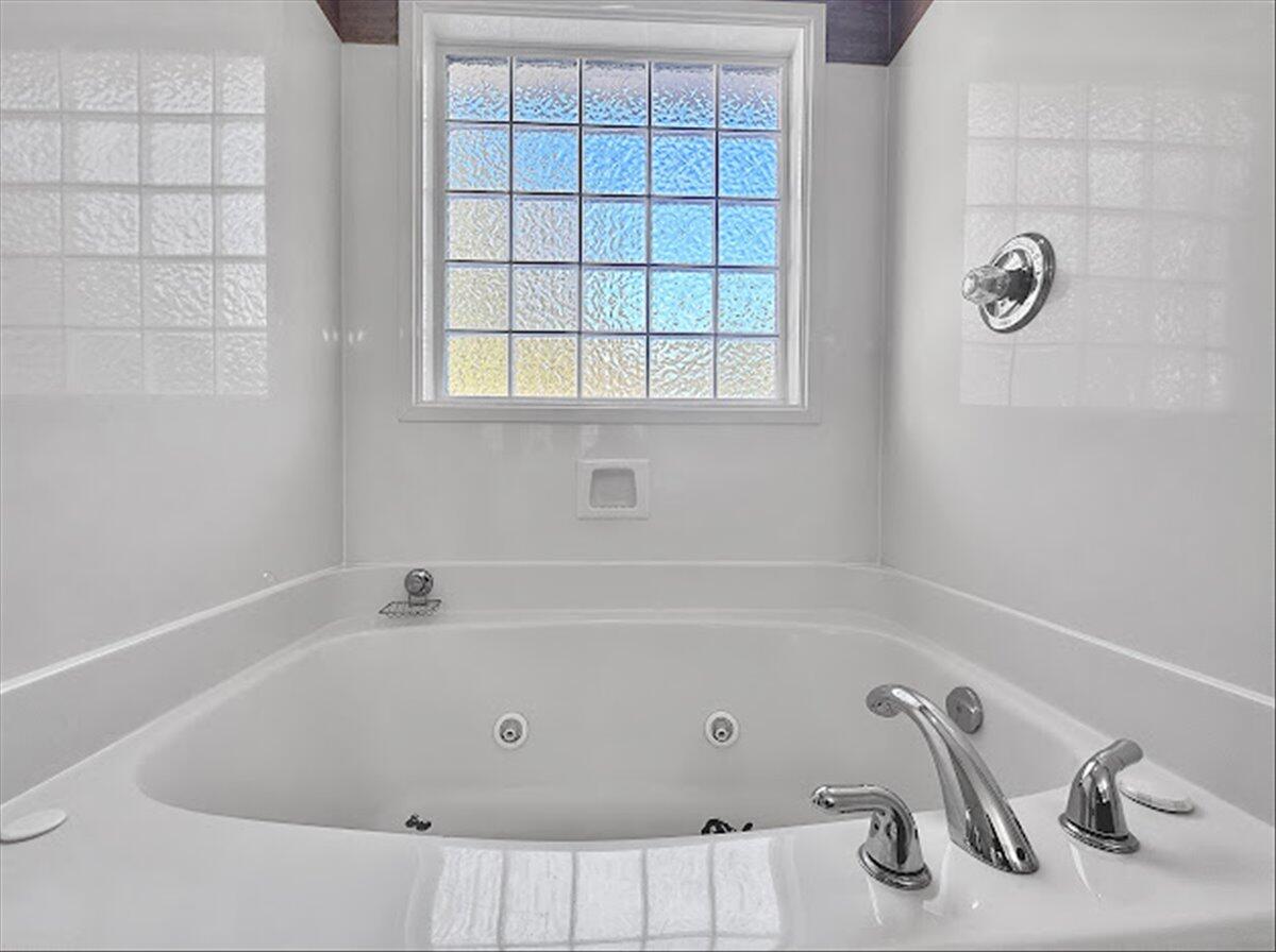 208 Hinote Road DeFuniak Springs, FL 32433 - Photo 24 of 49 a bathroom with a tub and a sink