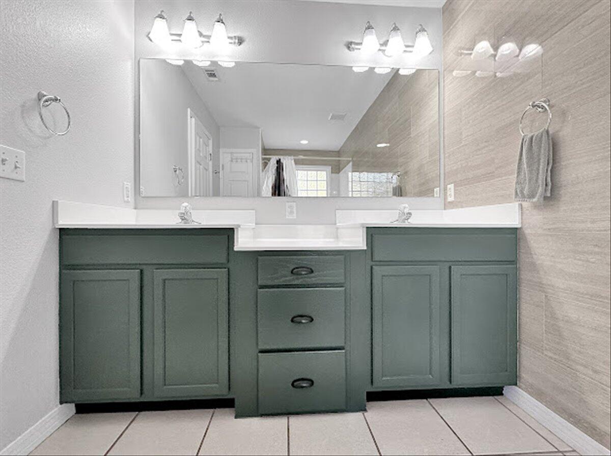 208 Hinote Road DeFuniak Springs, FL 32433 - Photo 25 of 49 a bathroom with a sink vanity and a mirror